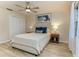 Serene bedroom with neutral tones, a ceiling fan, and natural light at 1433 Ne Old Mill Dr, Deltona, FL 32725