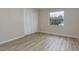 Empty bedroom with closet and light-filled window at 1433 Ne Old Mill Dr, Deltona, FL 32725