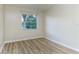 Bright bedroom with window and light walls at 1433 Ne Old Mill Dr, Deltona, FL 32725