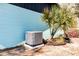 Exterior showing AC Unit next to a palm tree and the blue siding of the home at 1433 Ne Old Mill Dr, Deltona, FL 32725