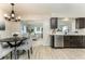 Well-lit kitchen open to the living area, featuring modern appliances and finishes at 1433 Ne Old Mill Dr, Deltona, FL 32725