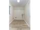 Empty laundry room featuring wood-look flooring and a window at 1433 Ne Old Mill Dr, Deltona, FL 32725