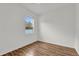 Bedroom featuring hardwood floors and a bright window providing natural light at 14851 Oldham Dr, Orlando, FL 32826