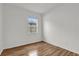 Bedroom featuring hardwood floors and a window providing natural light at 14851 Oldham Dr, Orlando, FL 32826