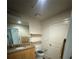 Bathroom featuring a sink with granite countertop, a toilet and decorative shelving at 155 S Court Ave # 1705, Orlando, FL 32801