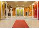 A well-maintained building entrance with glass doors and mosaic tiled walls at 155 S Court Ave # 1705, Orlando, FL 32801