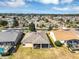 Aerial view of a community featuring well-maintained homes with manicured lawns, showcasing the neighborhood's layout and design at 15705 Sw 16Th Ter, Ocala, FL 34473