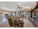 Cozy living room with a ceiling fan, entertainment center and sliding glass doors at 15705 Sw 16Th Ter, Ocala, FL 34473