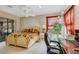 The bright main bedroom offers a ceiling fan and natural light from a sliding glass door at 15705 Sw 16Th Ter, Ocala, FL 34473