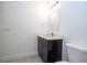 Contemporary bathroom with vanity, toilet, mirror and modern lighting at 15760 Sw 55Th Avenue Rd, Ocala, FL 34473