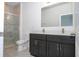 Bathroom features a walk-in shower, toilet, and double vanity sink at 15760 Sw 55Th Avenue Rd, Ocala, FL 34473