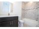 Bathroom featuring tiled shower/tub and a modern vanity at 15760 Sw 55Th Avenue Rd, Ocala, FL 34473