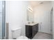 Bright bathroom features a shower, toilet, and vanity with double sinks at 15760 Sw 55Th Avenue Rd, Ocala, FL 34473