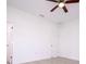 Bright bedroom features a ceiling fan and a door at 15760 Sw 55Th Avenue Rd, Ocala, FL 34473