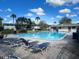 Community pool with lounge chairs, perfect for relaxing and enjoying the sun at 1695 Lee Rd # B109, Winter Park, FL 32789