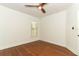 Bright bedroom featuring hardwood floors, a ceiling fan and a window with coverings at 2006 N Westmoreland Dr, Orlando, FL 32804