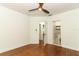 Bedroom featuring wood floors and access to a bathroom and an open closet at 2006 N Westmoreland Dr, Orlando, FL 32804