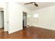 Bedroom showcasing a ceiling fan, hardwood floors, and a closet with black metal shelves at 2006 N Westmoreland Dr, Orlando, FL 32804