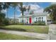 Inviting single-Gathering home with a landscaped lawn and a vibrant red front door at 2006 N Westmoreland Dr, Orlando, FL 32804