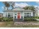 Charming single-story home with a bright red front door and well-manicured landscaping at 2006 N Westmoreland Dr, Orlando, FL 32804