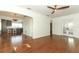 Open living space showcasing hardwood floors and seamless flow to the modern kitchen at 2006 N Westmoreland Dr, Orlando, FL 32804