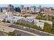 Stunning aerial shot of an apartment building located along a busy highway with city skyline at 206 E South St # 1030, Orlando, FL 32801