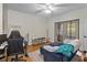 A relaxed living room features hardwood floors, a ceiling fan, a comfy sofa and a light colored accent rug at 206 E South St # 1030, Orlando, FL 32801