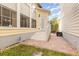 Back exterior view of home with brick patio, showing access to backyard and great natural light at 206 Norfolk Pl, Kissimmee, FL 34747