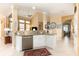 Open kitchen area featuring a breakfast bar, stainless steel dishwasher, and tile flooring at 206 Norfolk Pl, Kissimmee, FL 34747