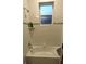 This bathtub features ceramic tile surround and a convenient soap dish at 207 Valencia Rd, Debary, FL 32713