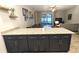 Stylish kitchen island featuring granite countertops and seating, ideal for casual dining at 207 Valencia Rd, Debary, FL 32713