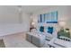 Upstairs living room featuring neutral tones, a sofa, and an open concept design at 2116 Red Rock Rd, New Smyrna Beach, FL 32168