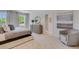 Well-lit main bedroom with plush carpet, tasteful decor, and a view into the bathroom at 2116 Red Rock Rd, New Smyrna Beach, FL 32168