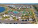 Aerial view of neighborhood pool with winding water features and a luxurious community center at 2377 Reading Trl, Kissimmee, FL 34746