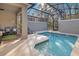 Sparkling pool with screened enclosure and lounge chairs for outdoor relaxation at 2377 Reading Trl, Kissimmee, FL 34746