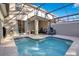 Sparkling pool with screened enclosure, patio seating and landscaped surroundings at 2377 Reading Trl, Kissimmee, FL 34746