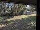 View of the backyard with a storage shed and outdoor seating area, perfect for enjoying the serene surroundings at 2429 S Elm Ave, Sanford, FL 32771