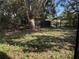 Expansive backyard featuring a large pergola, storage shed, and lush greenery for outdoor enjoyment at 2429 S Elm Ave, Sanford, FL 32771