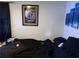 Bedroom with a black curtain, art on the wall, and bed at 2429 S Elm Ave, Sanford, FL 32771