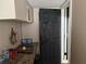 Hallway features marble countertop with decor and a black door at 2429 S Elm Ave, Sanford, FL 32771