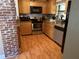 Functional kitchen featuring stainless steel appliances and ample cabinet space with laminate floor at 2429 S Elm Ave, Sanford, FL 32771