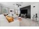 Well-lit living room featuring a modern entertainment center and comfortable seating at 3422 Seneca Club Loop # 57, Orlando, FL 32808