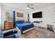 A cozy main bedroom features carpeted floors, a ceiling fan, a TV, and natural light from the windows at 3422 Seneca Club Loop # 57, Orlando, FL 32808