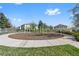 Community playground features a safe, mulched area with modern play equipment and seating surrounded by green grass at 3422 Seneca Club Loop # 57, Orlando, FL 32808