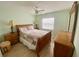 Serene bedroom featuring wood-look flooring, a ceiling fan, and coordinating furniture for a comfortable retreat at 413 Country Wood Cir, Lake Mary, FL 32746