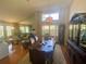 Bright dining room featuring high ceilings, large dining table, and elegant china cabinet at 413 Country Wood Cir, Lake Mary, FL 32746