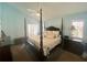 Spacious main bedroom with large bed, ceiling fan, shutters, and neutral color palette at 413 Country Wood Cir, Lake Mary, FL 32746