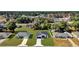 Aerial view of the house, showcasing the neighborhood and surrounding trees at 420 Marion Oaks Crse, Ocala, FL 34473