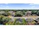 Aerial view of a residential neighborhood featuring tree-lined streets and single-Gathering homes with well-maintained lawns at 420 Marion Oaks Crse, Ocala, FL 34473