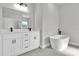 Bathroom featuring double sink vanity, modern fixtures, a free-standing tub, and neutral finishes at 420 Marion Oaks Crse, Ocala, FL 34473